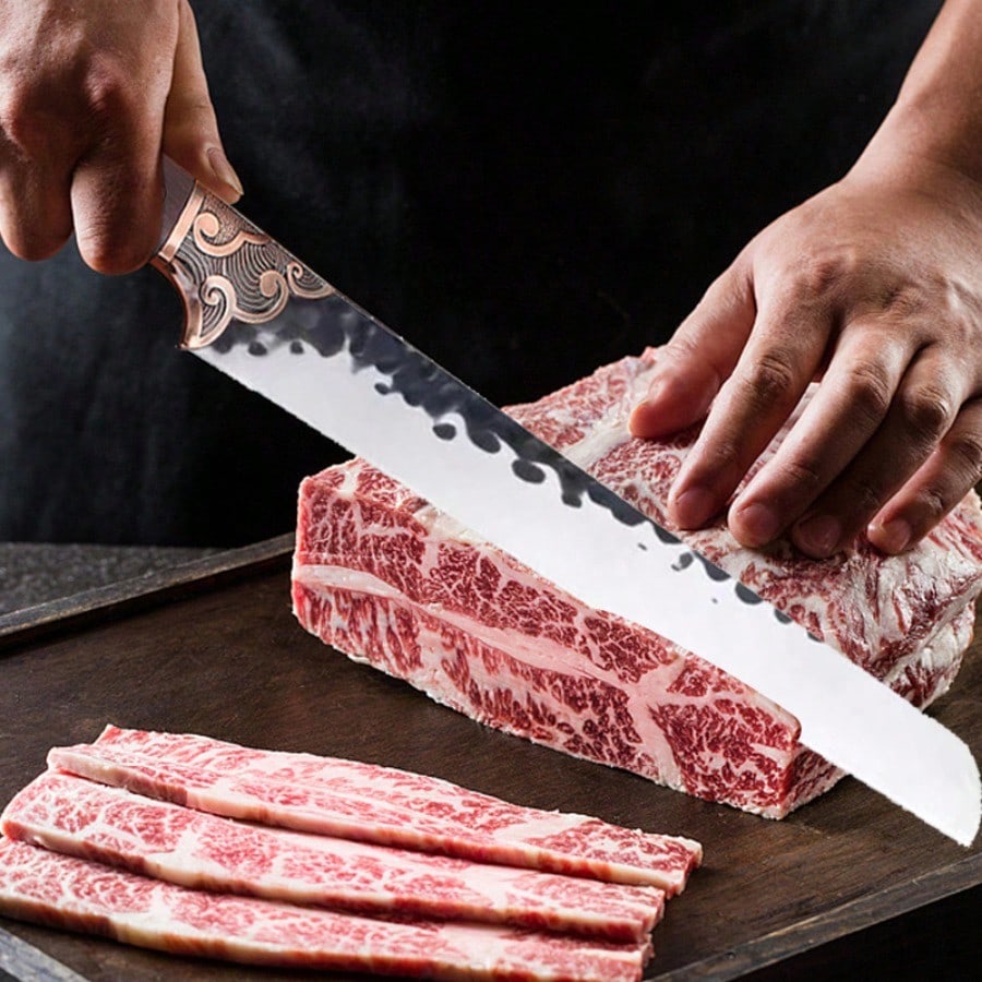 Triple-riveted hardwood handle detail of forged carving knife